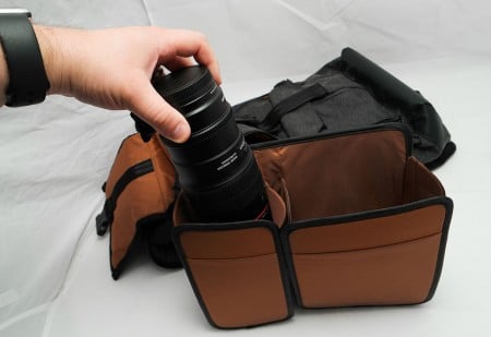 One side for a lens, another for a small body. While you can store the gear when the section is outside the backpack, you'll want to pack the bag when this section is on the inside, otherwise it probably won't go in easily.